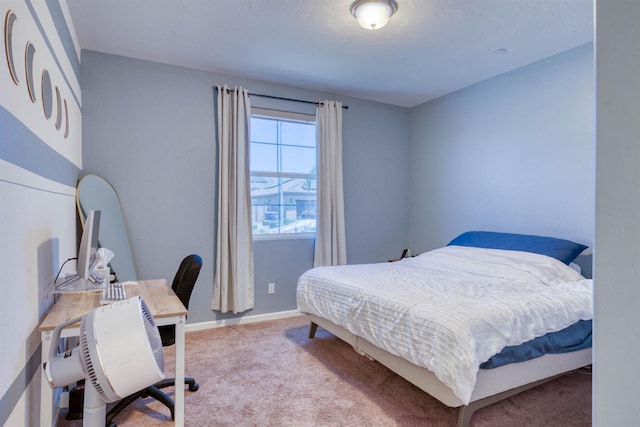 6659 E Vassar Ave, Fresno, CA 93727 - carpeted bedroom featuring a desk and baseboards