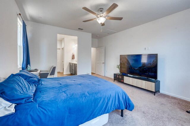6659 E Vassar Ave, Fresno, CA 93727 - carpeted bedroom featuring baseboards, ceiling fan, and connected bathroom