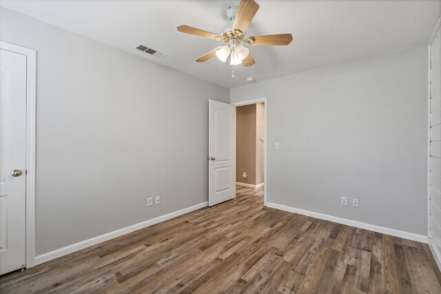 10131 N Price Ave, Fresno, CA 93730 - spare room with a ceiling fan, baseboards, and wood finished floors