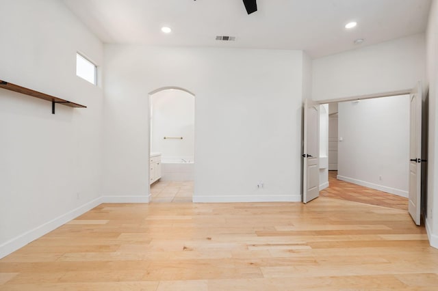 2189 W Via Delfini, Fresno, CA 93711 - spare room featuring arched walkways, recessed lighting, light wood-style floors, and baseboards