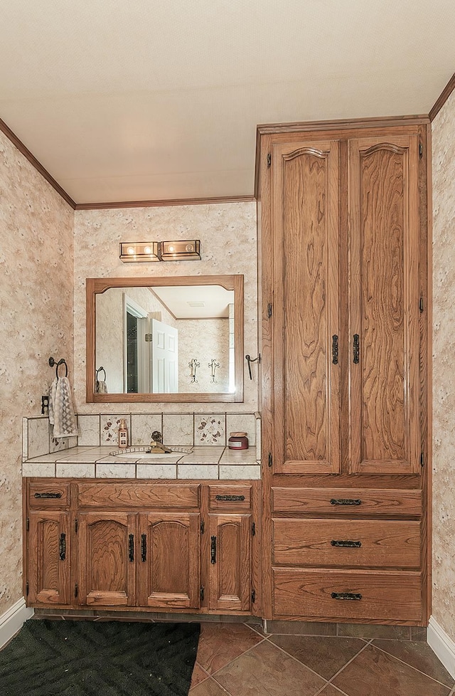 311 S Fowler Ave, Fowler, CA 93625 - bathroom featuring vanity, tile patterned flooring, baseboards, and ornamental molding