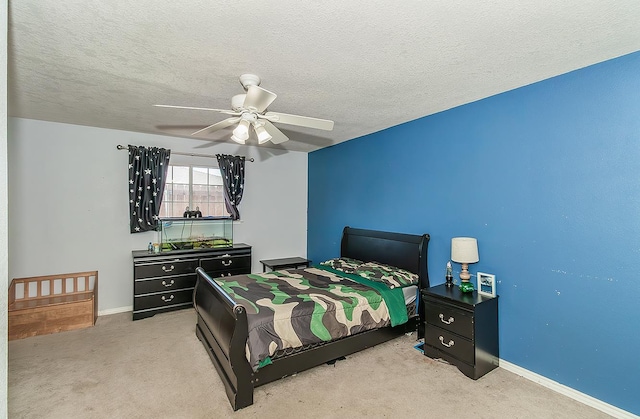 311 S Fowler Ave, Fowler, CA 93625 - carpeted bedroom featuring baseboards, a ceiling fan, and a textured ceiling