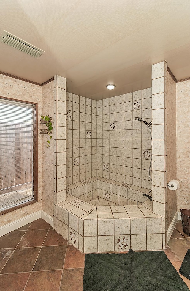 311 S Fowler Ave, Fowler, CA 93625 - bathroom featuring a tile shower, tile patterned flooring, and baseboards