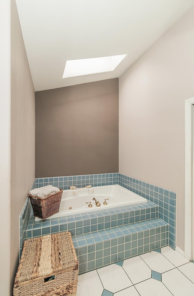 311 S Fowler Ave, Fowler, CA 93625 - bathroom featuring a skylight, a whirlpool tub, and tile patterned floors