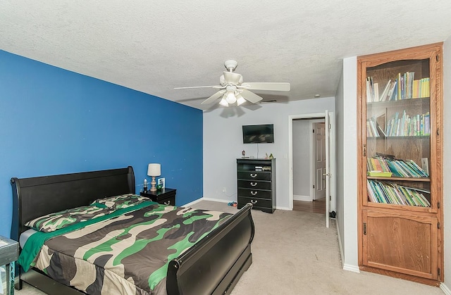 311 S Fowler Ave, Fowler, CA 93625 - bedroom with baseboards, light colored carpet, a textured ceiling, and ceiling fan