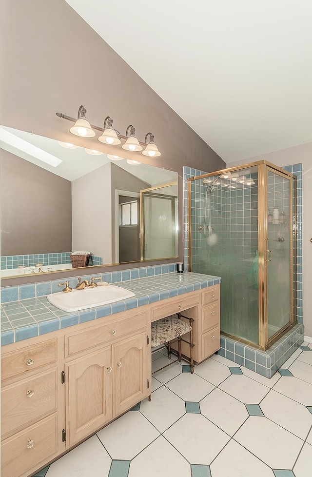 311 S Fowler Ave, Fowler, CA 93625 - bathroom featuring vanity, a stall shower, vaulted ceiling, and tile patterned floors