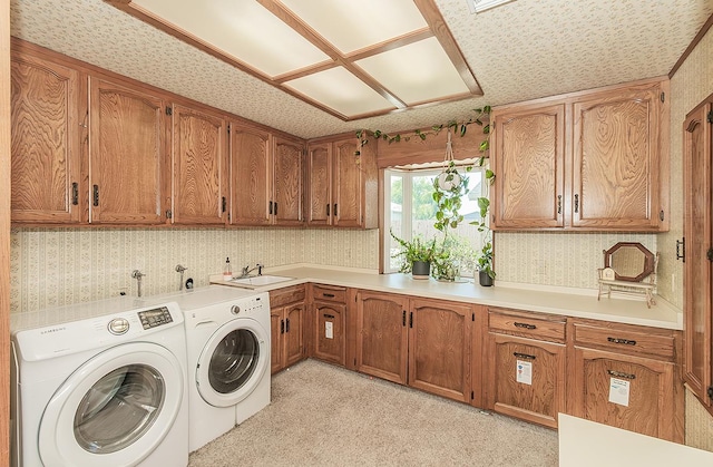 311 S Fowler Ave, Fowler, CA 93625 - laundry area featuring cabinet space, wallpapered walls, and washing machine and dryer