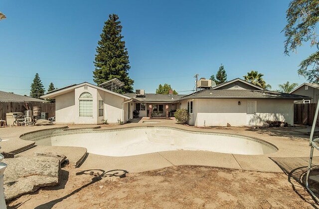 311 S Fowler Ave, Fowler, CA 93625 - view of pool featuring an empty pool, a patio area, and central AC