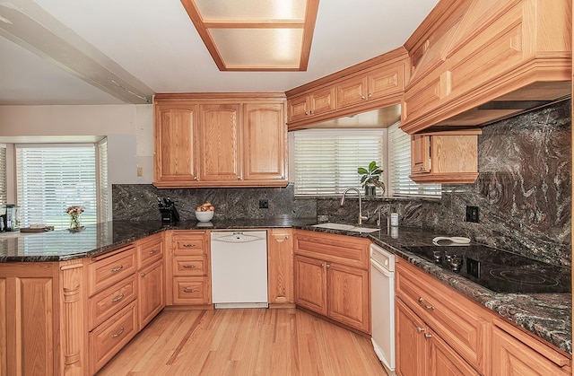 311 S Fowler Ave, Fowler, CA 93625 - kitchen with white dishwasher, a sink, black electric stovetop, custom exhaust hood, and light wood-style flooring