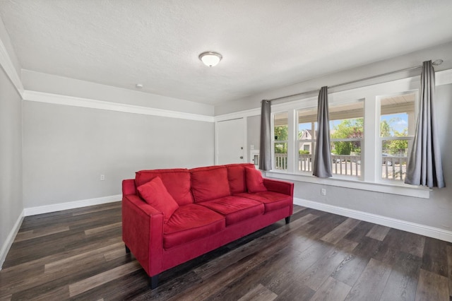 4112 E Platt Ave, Fresno, CA 93702 - living room with baseboards, wood finished floors, and a textured ceiling