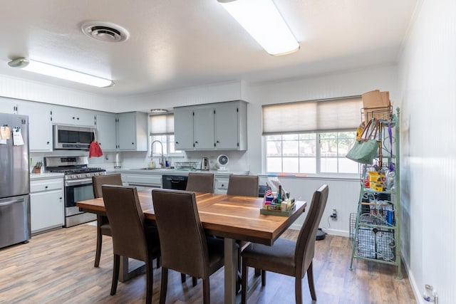 101 S Princeton Ave, Coalinga, CA 93210 - dining area featuring light wood-style floors and baseboards