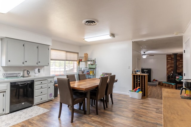 101 S Princeton Ave, Coalinga, CA 93210 - dining room with a wood stove and wood finished floors
