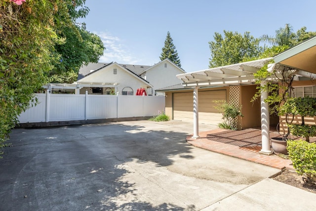450 W Alluvial Ave, Clovis, CA 93611 - view of patio / terrace with concrete driveway, an attached garage, and a pergola