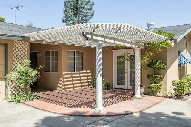 450 W Alluvial Ave, Clovis, CA 93611 - property entrance featuring french doors, a pergola, and stucco siding