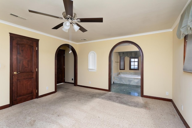 450 W Alluvial Ave, Clovis, CA 93611 - carpeted spare room with arched walkways, baseboards, a ceiling fan, and crown molding