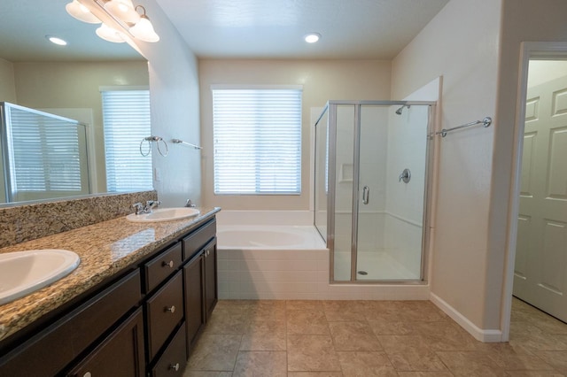 3083 N Stanley Ave, Fresno, CA 93737 - full bathroom with a stall shower, a bath, and double vanity