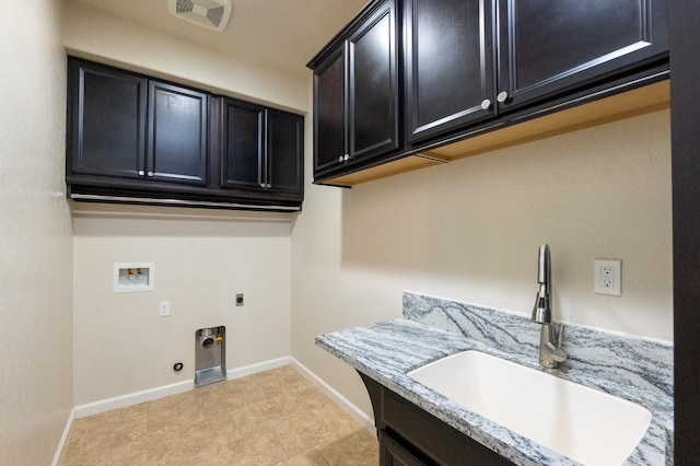 3083 N Stanley Ave, Fresno, CA 93737 - washroom with cabinet space, hookup for an electric dryer, washer hookup, and baseboards