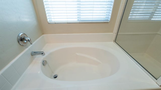3083 N Stanley Ave, Fresno, CA 93737 - bathroom featuring plenty of natural light and a garden tub