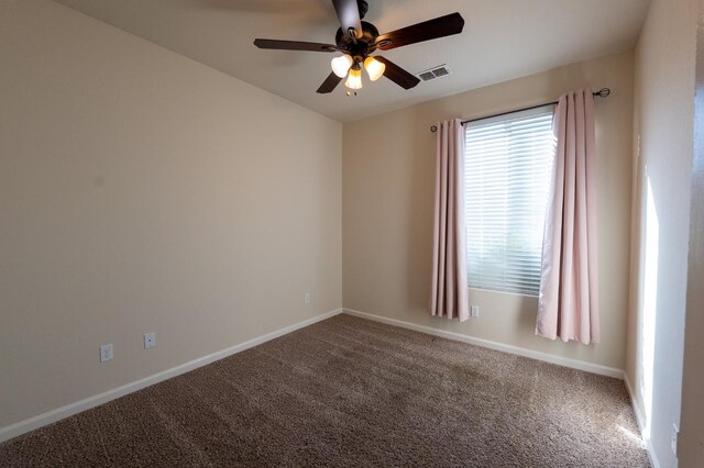 3083 N Stanley Ave, Fresno, CA 93737 - empty room with a ceiling fan, carpet, and baseboards