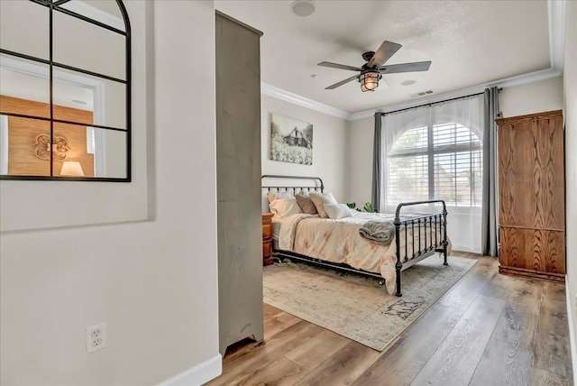 1281 W Walter Ave Unit 15, Fowler, CA 93625 - bedroom featuring crown molding, wood finished floors, baseboards, and ceiling fan