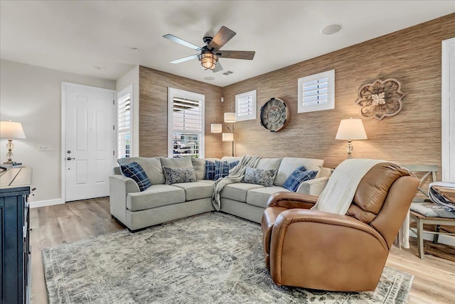 1281 W Walter Ave Unit 15, Fowler, CA 93625 - living room with a ceiling fan, baseboards, and light wood finished floors
