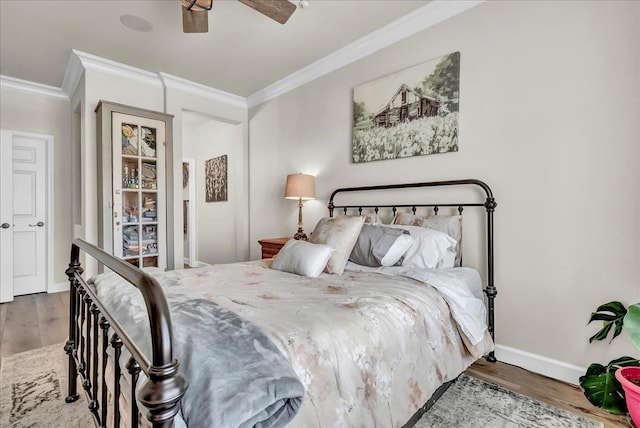 1281 W Walter Ave Unit 15, Fowler, CA 93625 - bedroom with ornamental molding, wood finished floors, baseboards, and ceiling fan