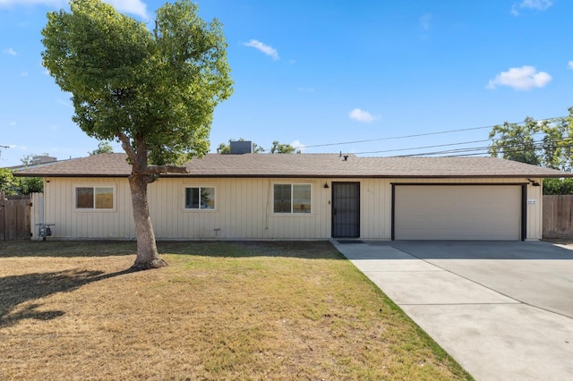 2316 S Kirk St, Fresno, CA 93706 - ranch-style home with a garage, concrete driveway, and a shingled roof