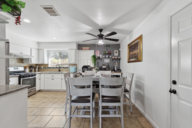 2316 S Kirk St, Fresno, CA 93706 - dining space featuring ceiling fan, light tile patterned floors, and recessed lighting