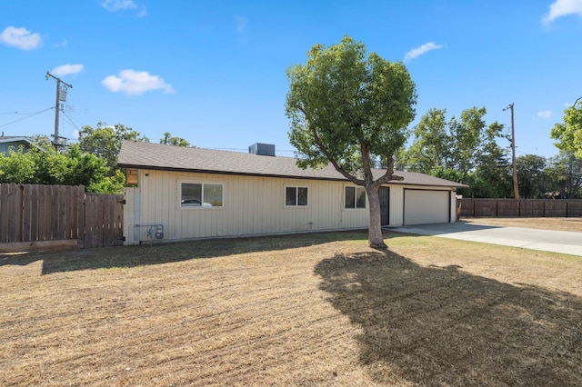 2316 S Kirk St, Fresno, CA 93706 - ranch-style house with concrete driveway, an attached garage, and a shingled roof