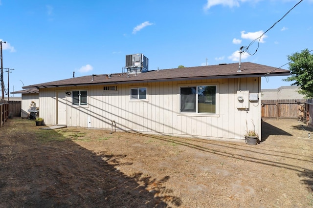 2316 S Kirk St, Fresno, CA 93706 - rear view of property featuring a fenced backyard and central AC