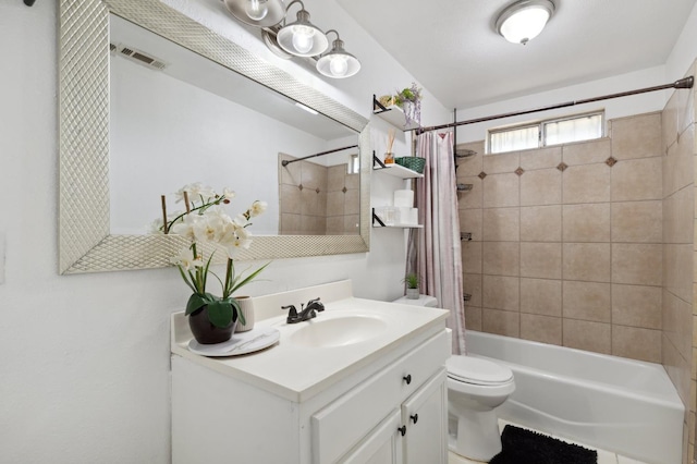 2316 S Kirk St, Fresno, CA 93706 - bathroom with vanity, shower / bath combo with shower curtain, and toilet