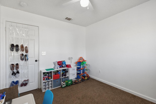 2316 S Kirk St, Fresno, CA 93706 - recreation room with carpet flooring, a ceiling fan, and baseboards