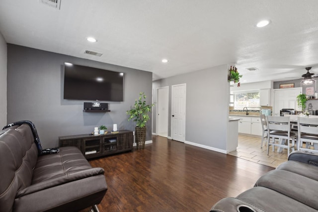 2316 S Kirk St, Fresno, CA 93706 - living area with a ceiling fan, baseboards, recessed lighting, and wood finished floors