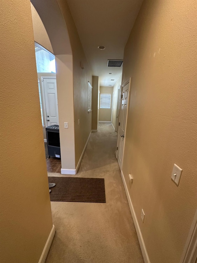 5804 W Chennault Ave, Fresno, CA 93722 - corridor featuring carpet, baseboards, and arched walkways