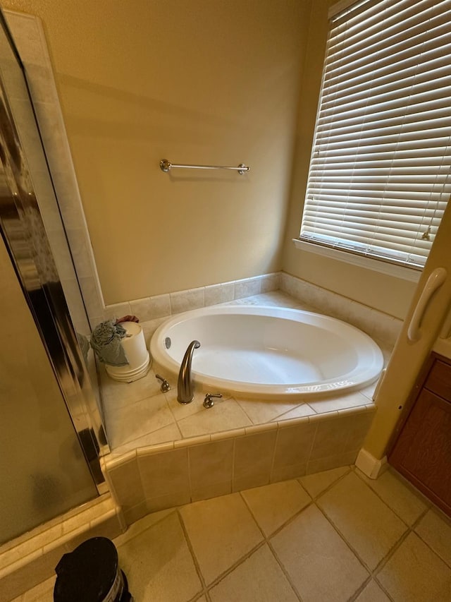 5804 W Chennault Ave, Fresno, CA 93722 - full bath featuring a stall shower, a garden tub, and tile patterned floors