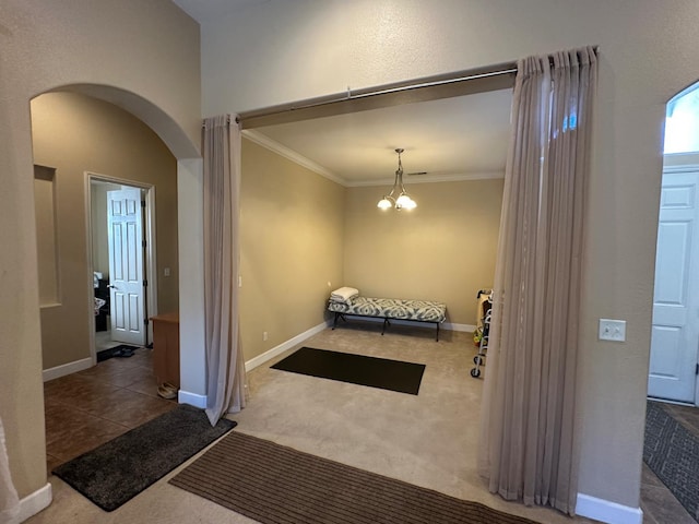 5804 W Chennault Ave, Fresno, CA 93722 - carpeted foyer with arched walkways, ornamental molding, a chandelier, and baseboards
