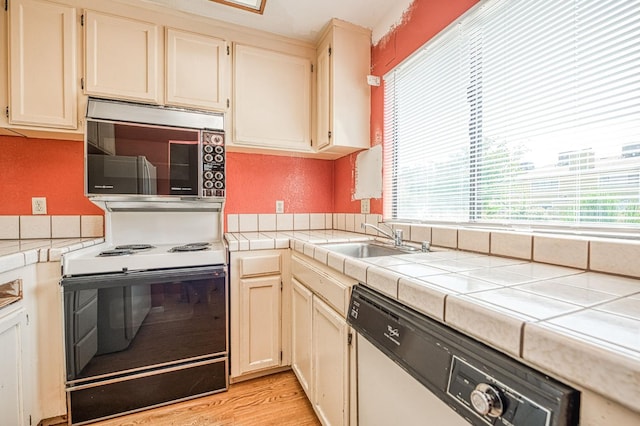 4885 N Backer Ave Unit 151, Fresno, CA 93726 - kitchen with stainless steel microwave, dishwasher, range with electric stovetop, and plenty of natural light