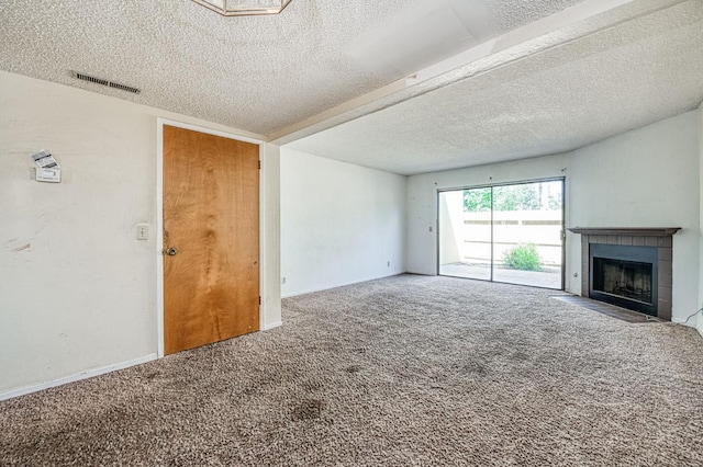 4885 N Backer Ave Unit 151, Fresno, CA 93726 - unfurnished living room featuring carpet, a textured ceiling, and a fireplace