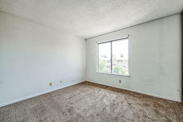 4885 N Backer Ave Unit 151, Fresno, CA 93726 - carpeted empty room with a textured ceiling and baseboards