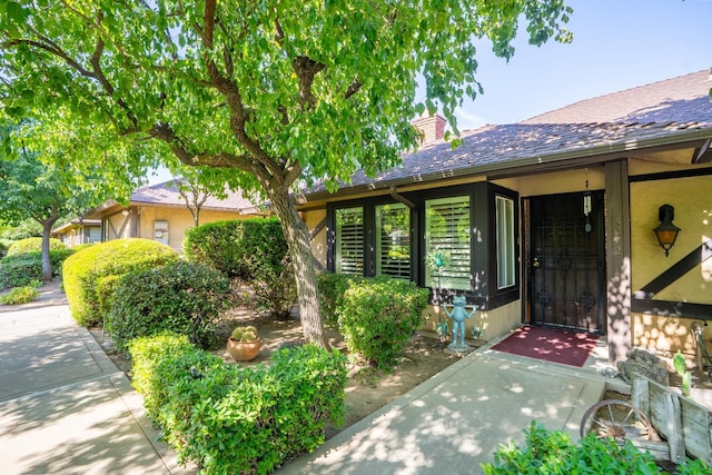 5072 N Forkner Ave, Fresno, CA 93711 - property entrance with a chimney