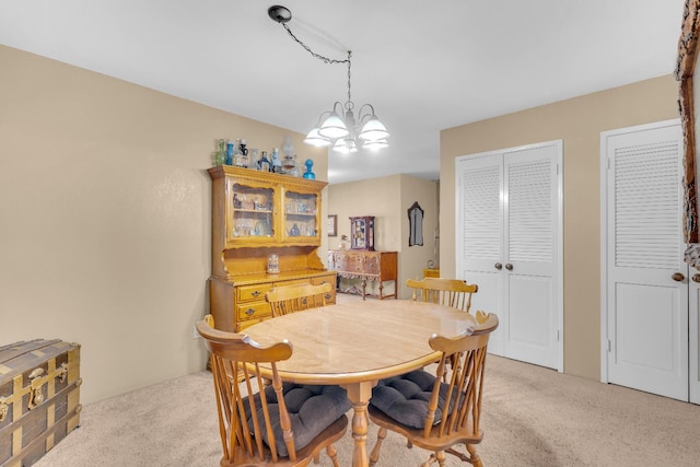 5072 N Forkner Ave, Fresno, CA 93711 - dining area with light carpet and a chandelier