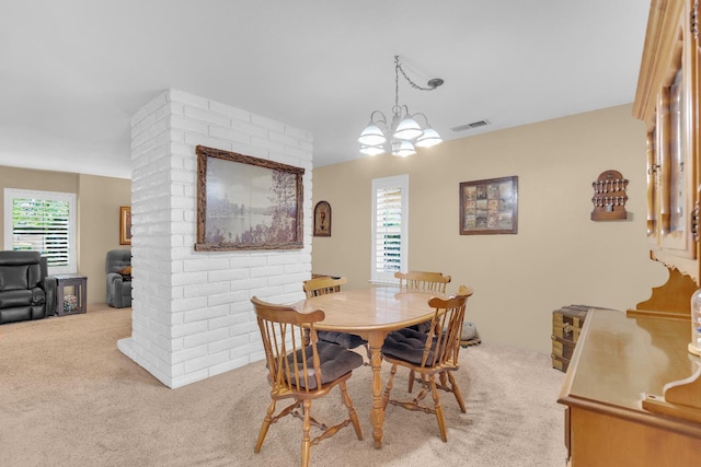 5072 N Forkner Ave, Fresno, CA 93711 - dining space featuring carpet floors and a chandelier