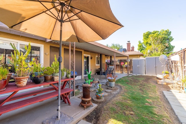 5072 N Forkner Ave, Fresno, CA 93711 - fenced backyard with a gate and a patio area