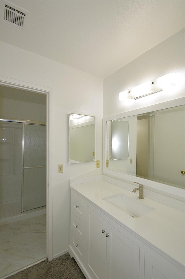 4779 N Cedar Ave # 109, Fresno, CA 93726 - bathroom with vanity, a stall shower, and baseboards