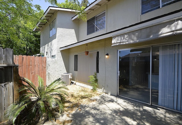 4779 N Cedar Ave # 109, Fresno, CA 93726 - exterior space with stucco siding, cooling unit, and a patio area