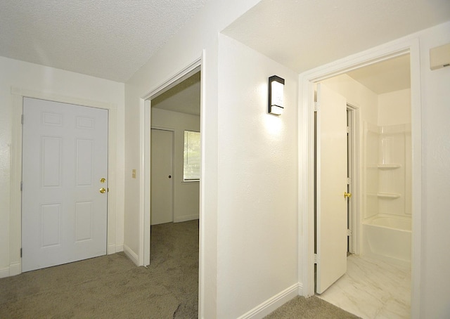 4779 N Cedar Ave # 109, Fresno, CA 93726 - corridor featuring baseboards and light colored carpet