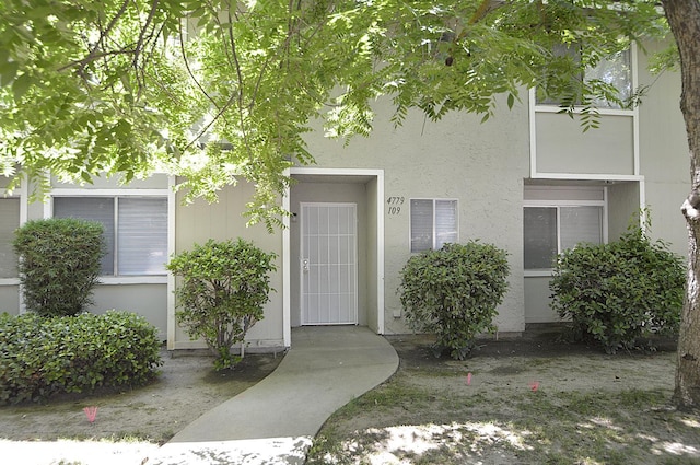 4779 N Cedar Ave # 109, Fresno, CA 93726 - doorway to property featuring stucco siding