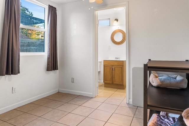 1586 N Calaveras St, Fresno, CA 93728 - bathroom featuring tile patterned floors, vanity, baseboards, and ceiling fan