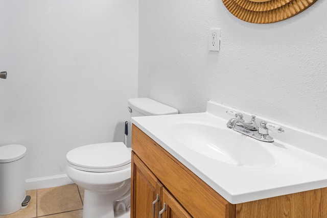 1586 N Calaveras St, Fresno, CA 93728 - bathroom with toilet, vanity, tile patterned flooring, and baseboards