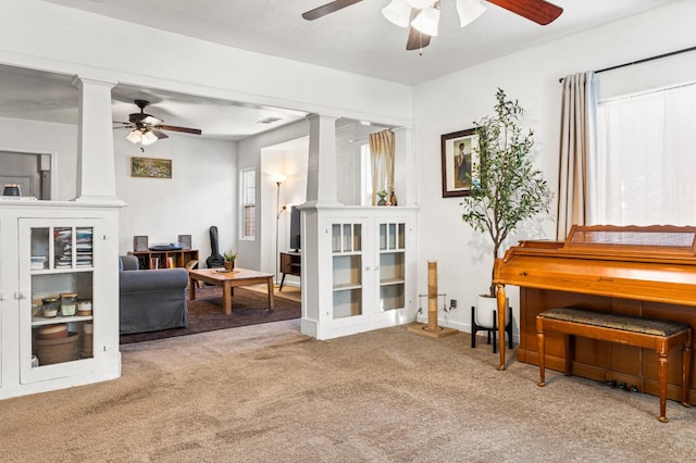 1586 N Calaveras St, Fresno, CA 93728 - sitting room featuring decorative columns, ceiling fan, and carpet